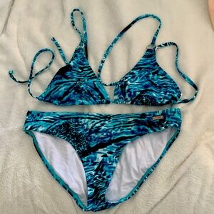 Venus triangle top bikini size 12. Silver ring embellishments.Never been worn.